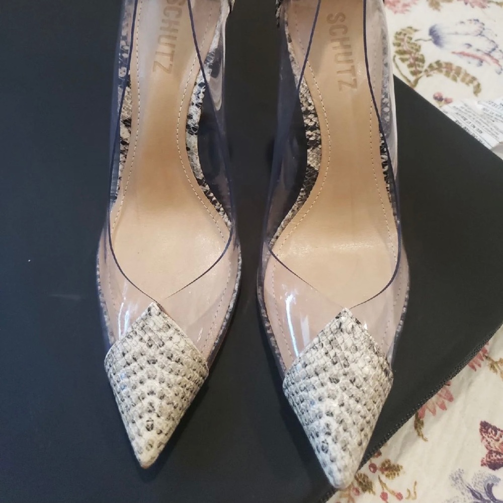 Schutz snake print pumps.
